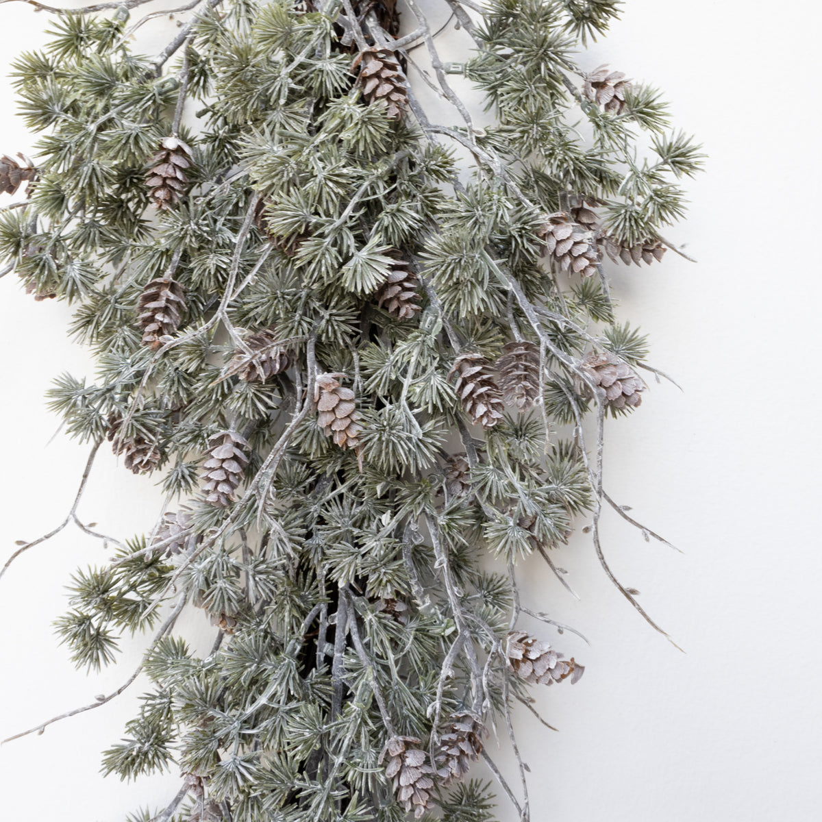 Frosted Cedar Door Swag with Pinecones